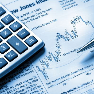 Financial pages and a calculator.